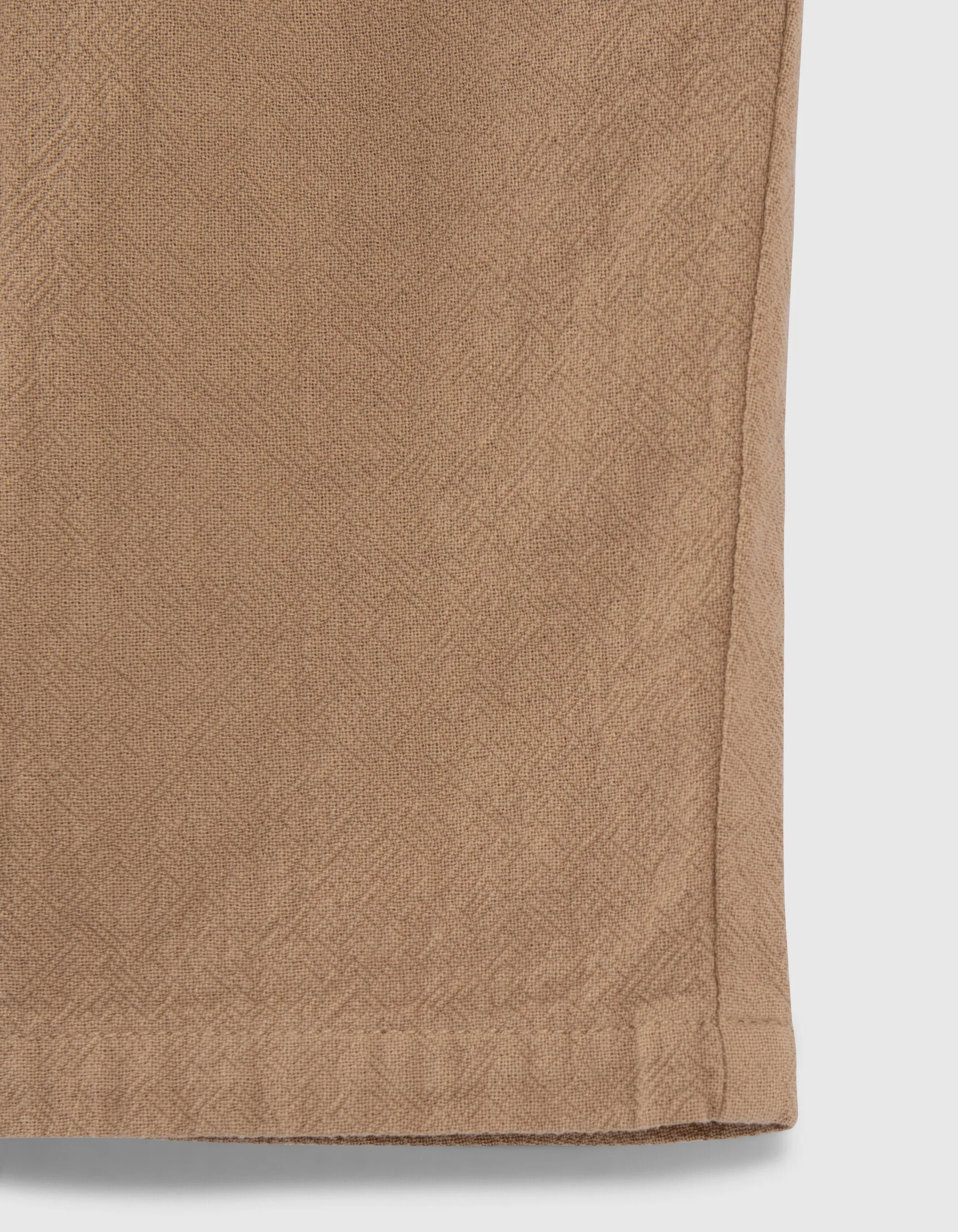 Khaki textured fabric boy shorts.