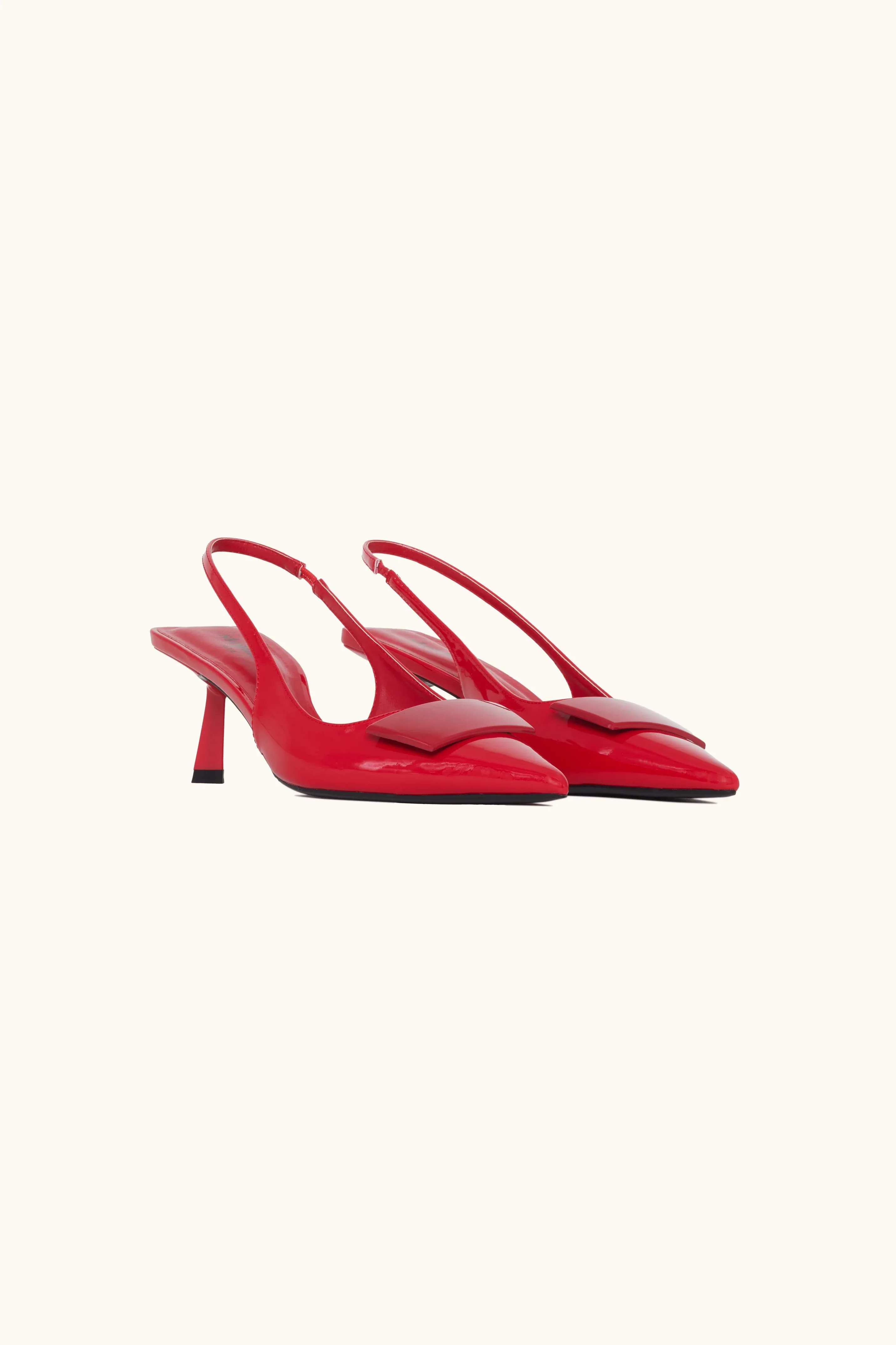 Red patent leather slingback pumps.